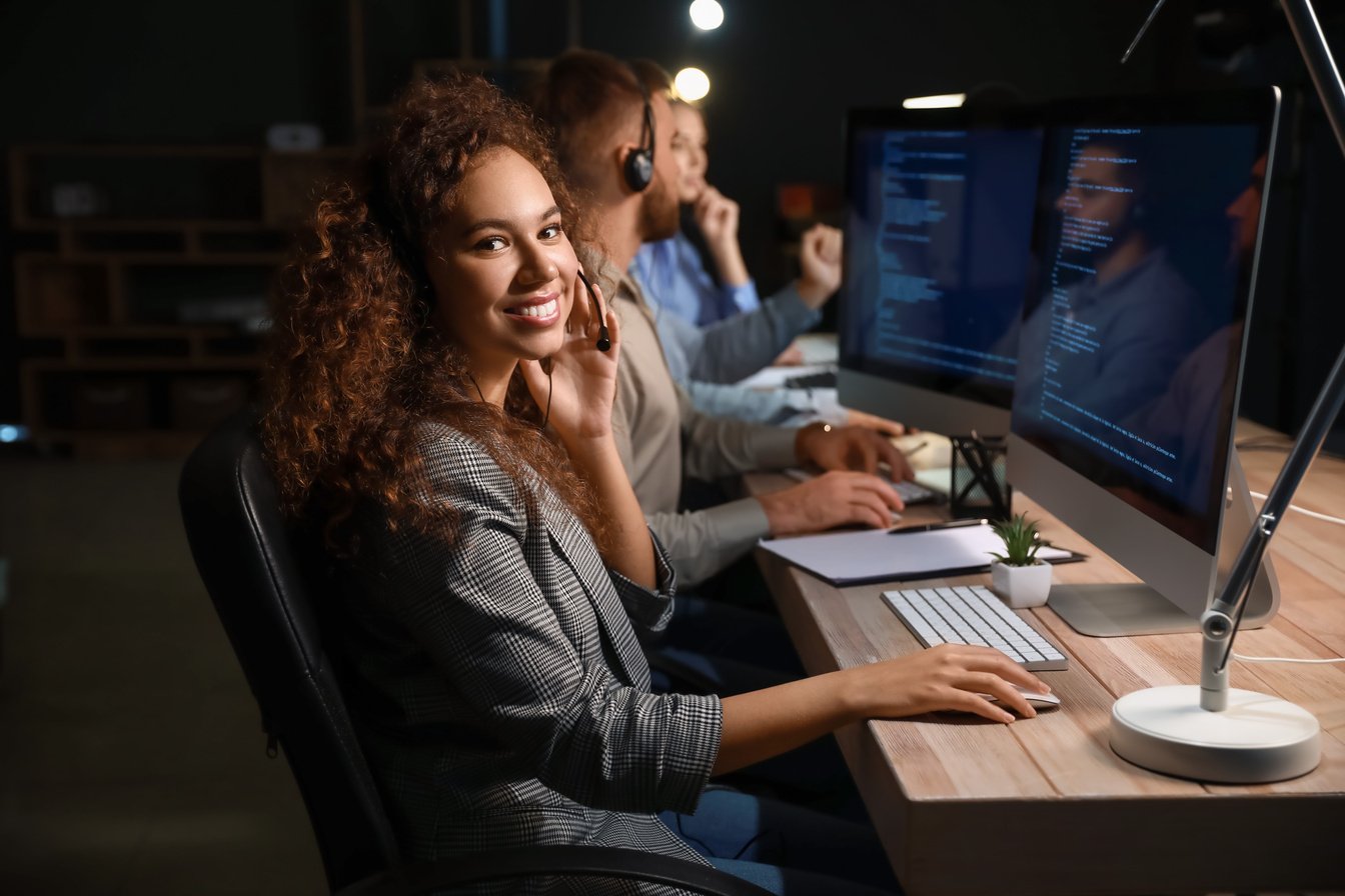 Technical Support Agents Working in Office at Night